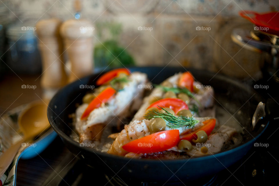 Dish with Sea bass fried with vegetables 