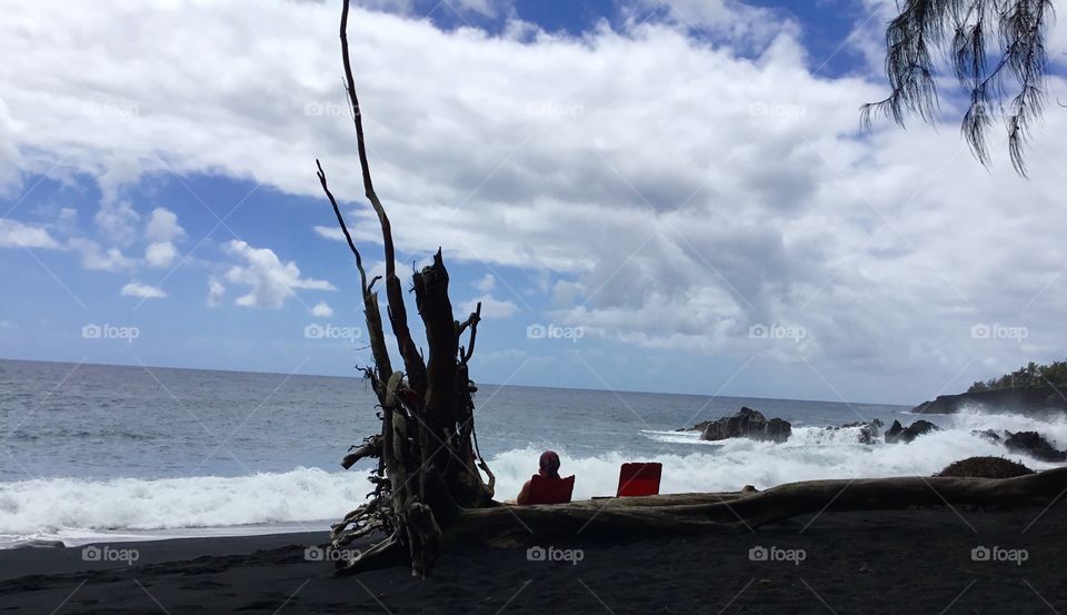 Enjoying the surf at the black sand beach