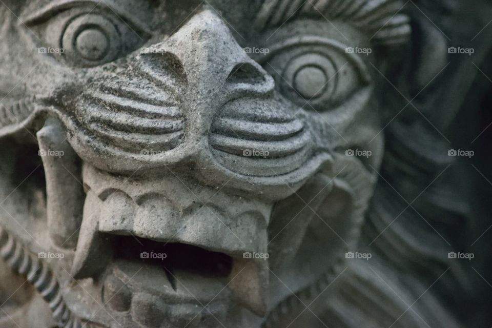 Closeup of a temple statue in Ubud Bali