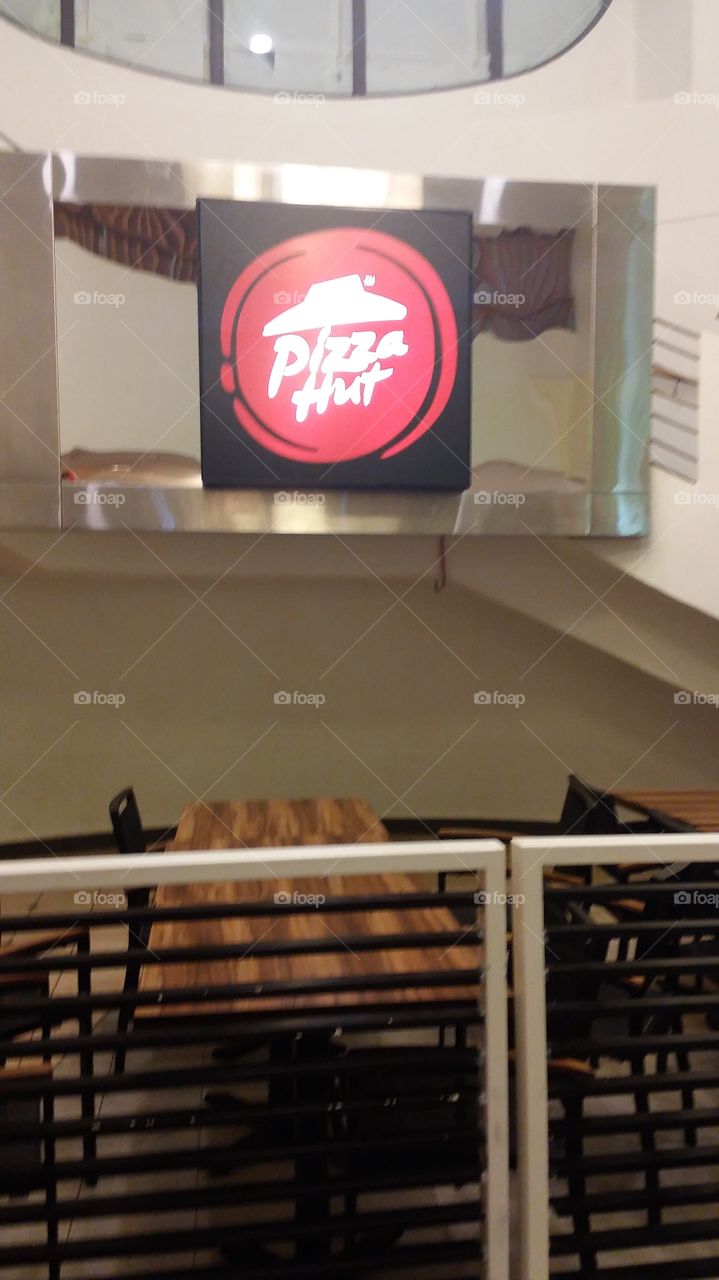 at pizzahut dining area sign.