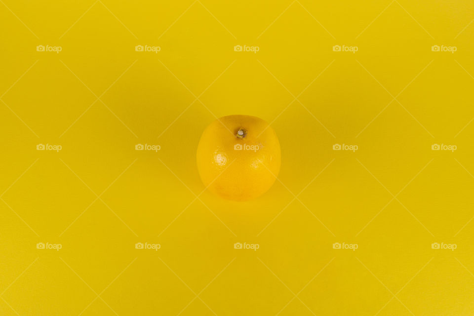 monochrome background with lemon on yellow
