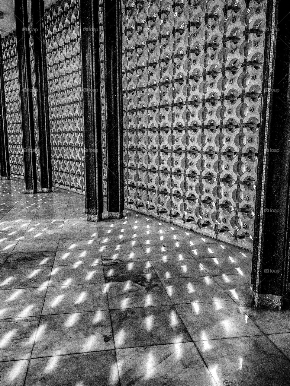 Lights came through small opening of a building wall