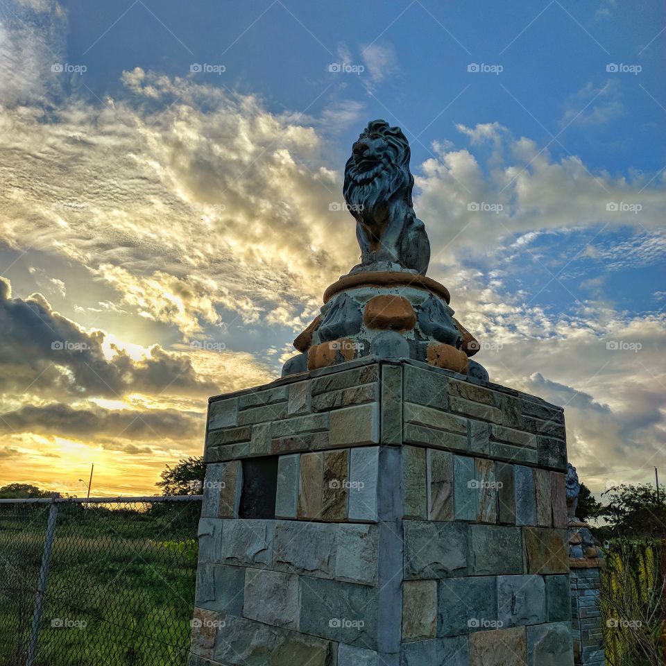 lion sculpture with fantastic sunset and sky view
