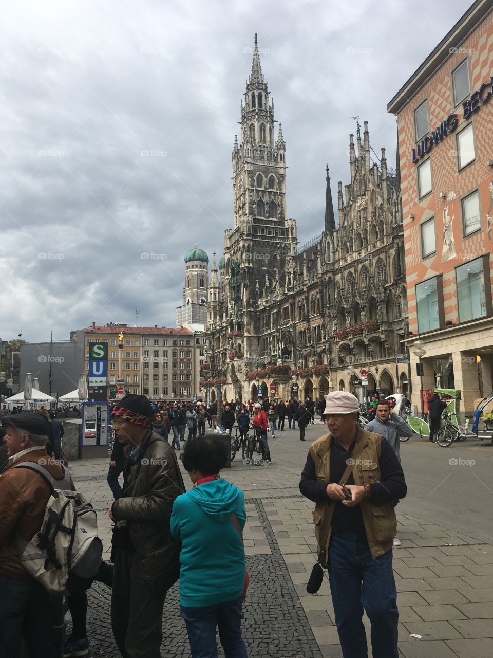 Crowded streets of Munich, Germany on a cloudy fall day. All the hustle and bustle of city life amongst ancient buildings 
