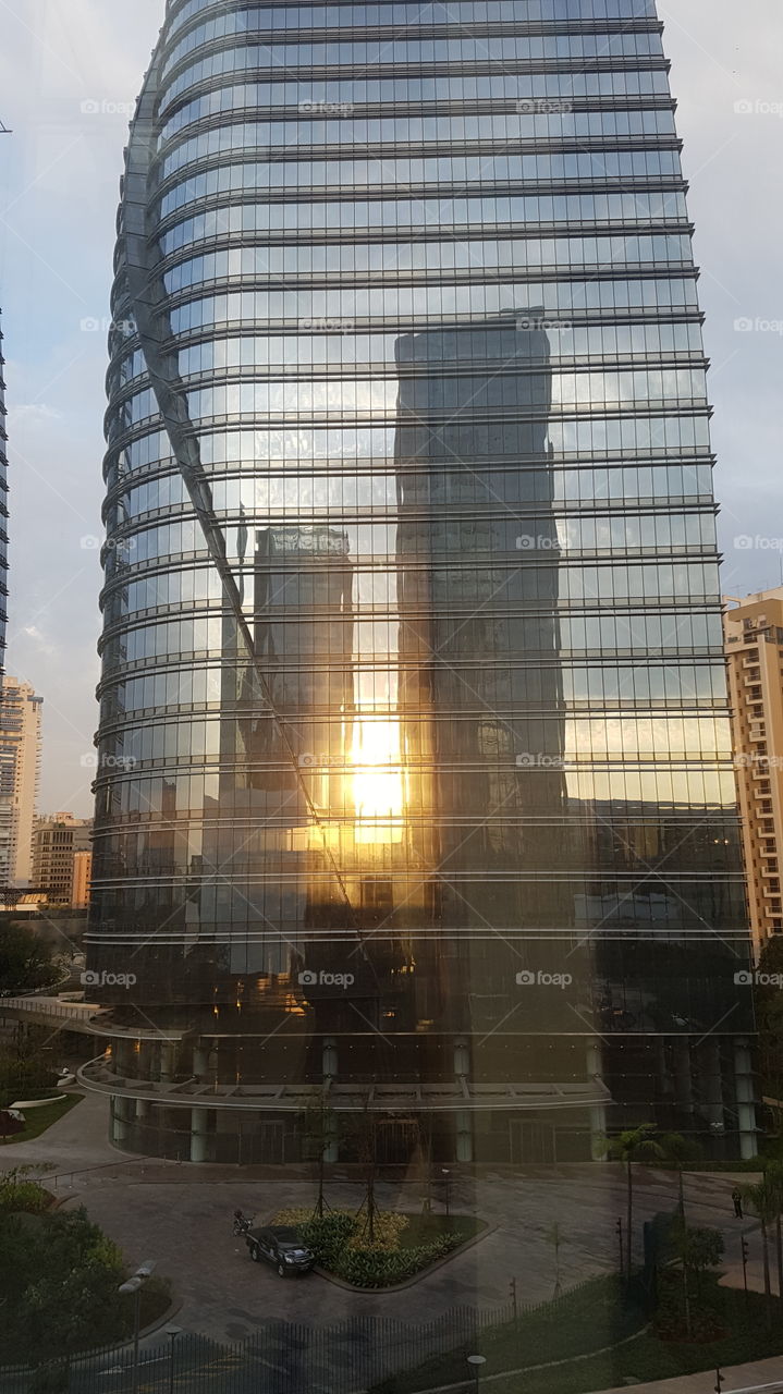 sun and buildings reflection