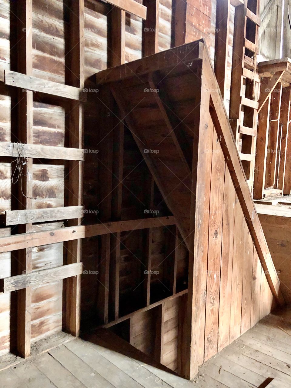 Exploring the stairs in an old rustic hay barn.