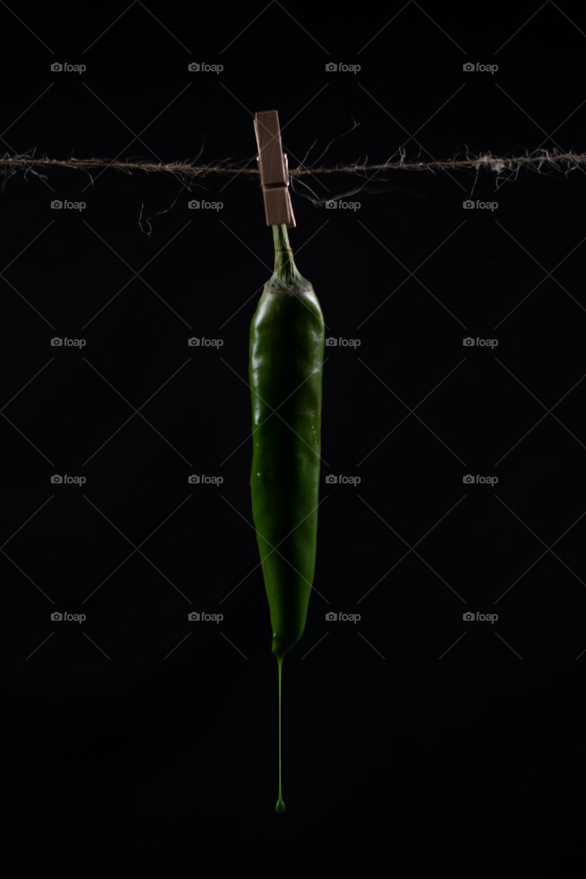 Close up Green chili pepper and water drop