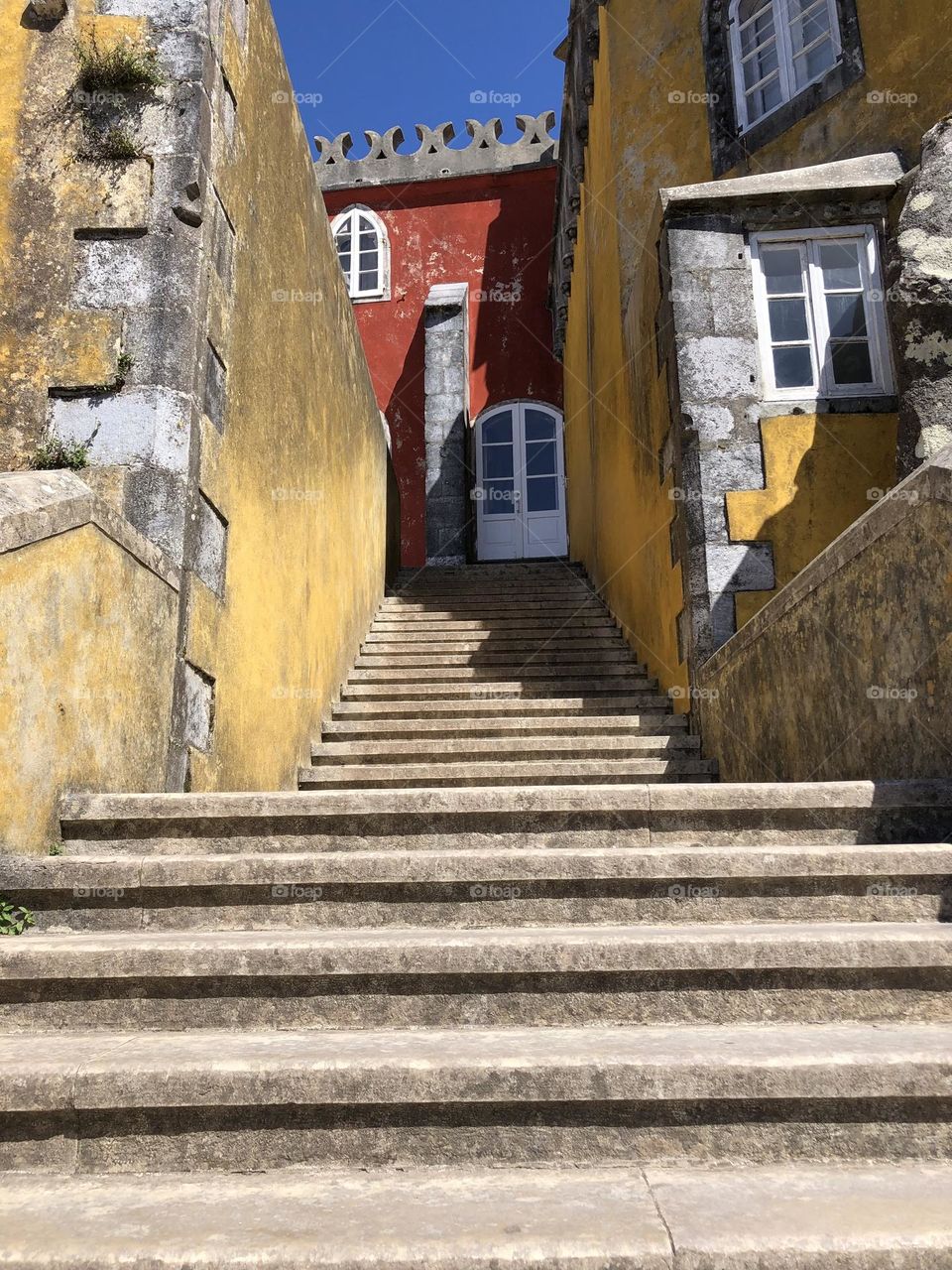 Stairs from Sintra castle painted in yellow and red