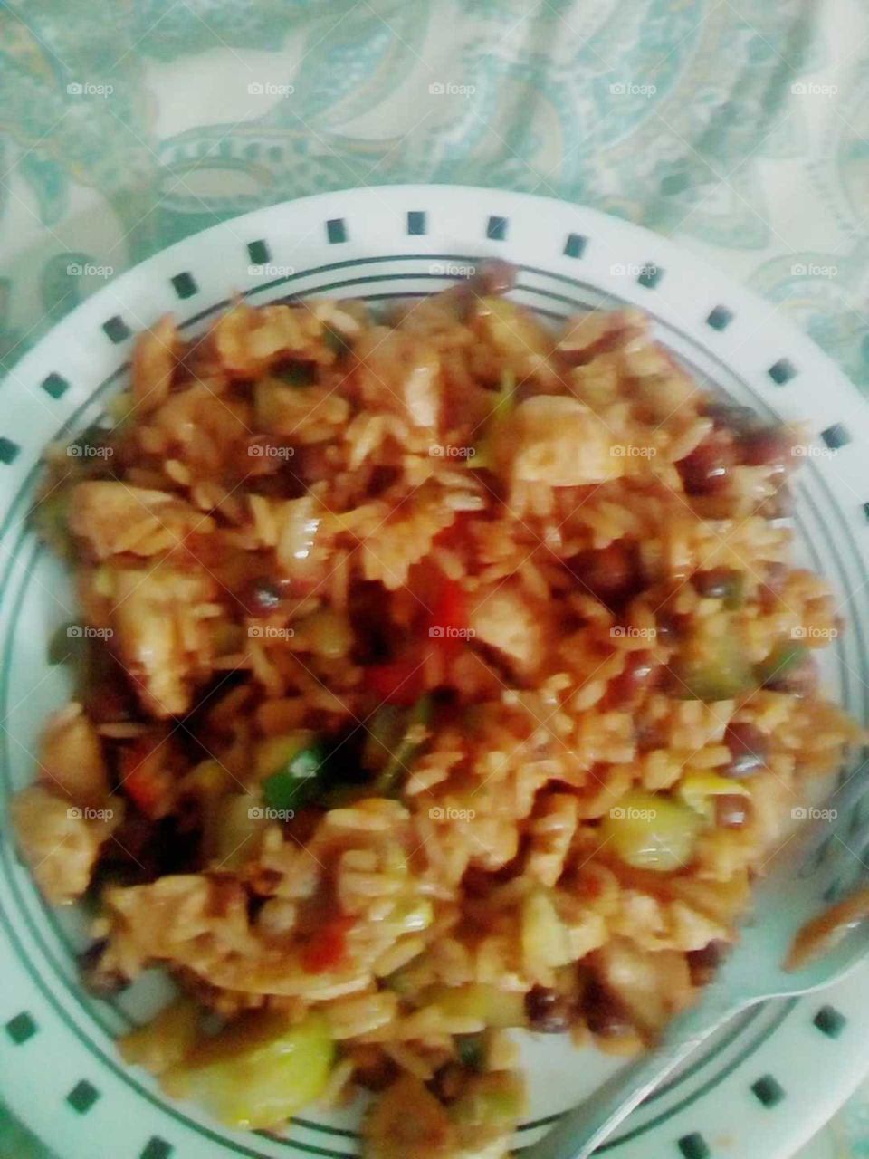 this beautiful meal is made from rice and beans and chicken very hard to make because you have to cook the peas first .