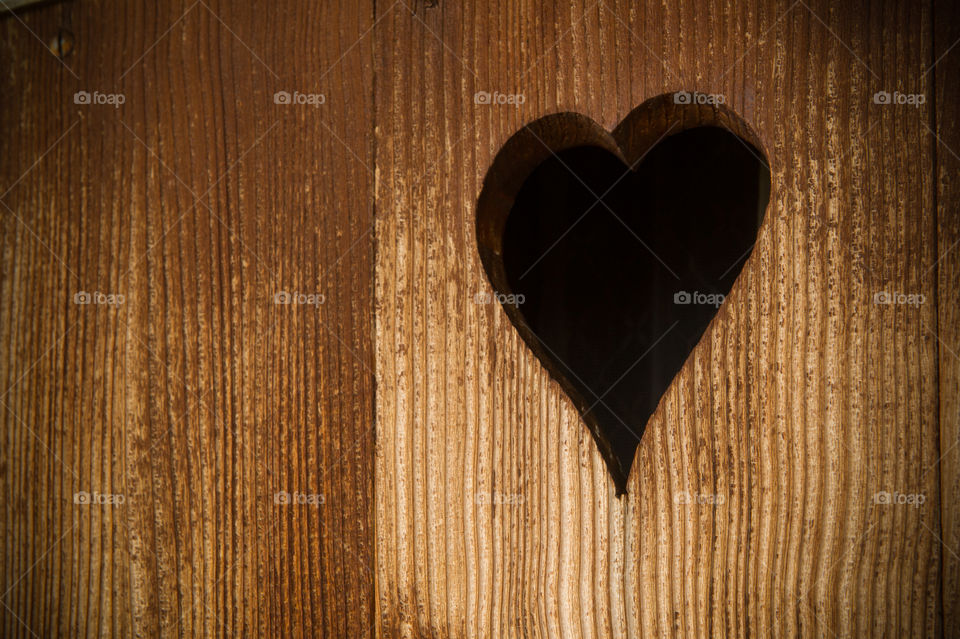 wooden shutter with a heart 