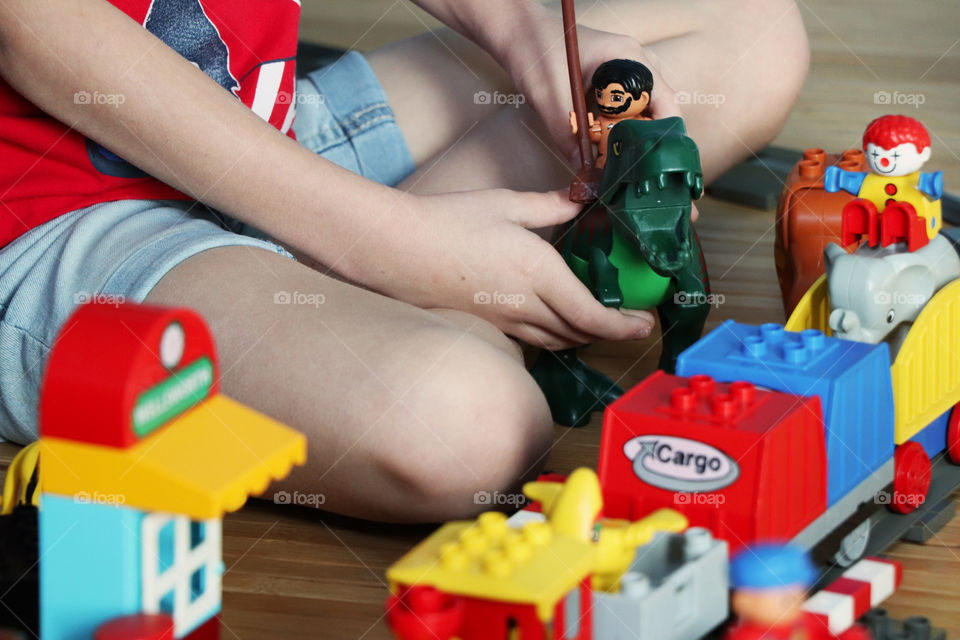 Child playing with Lego Duplo