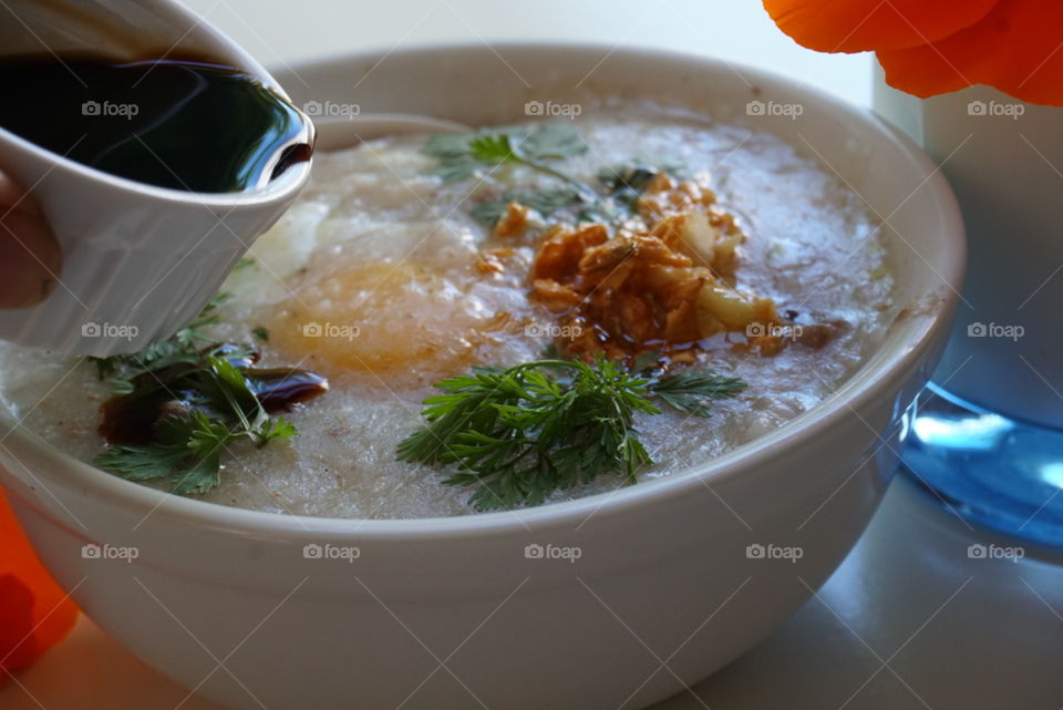 Fun breakfast rice soup sunny side up egg