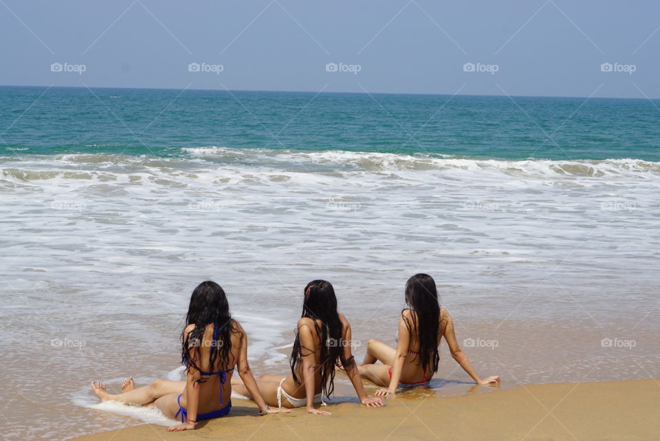 Three besties spending their time on the beach