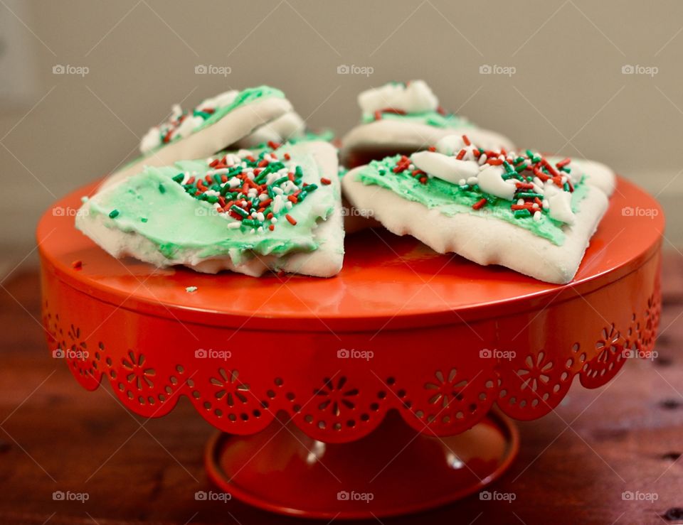 Delicious sugar cookies on a red cake stand