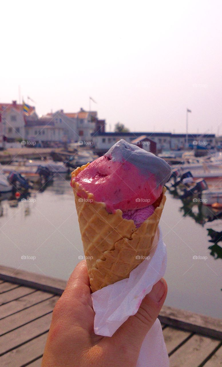 Close-up of hand holding ice cream