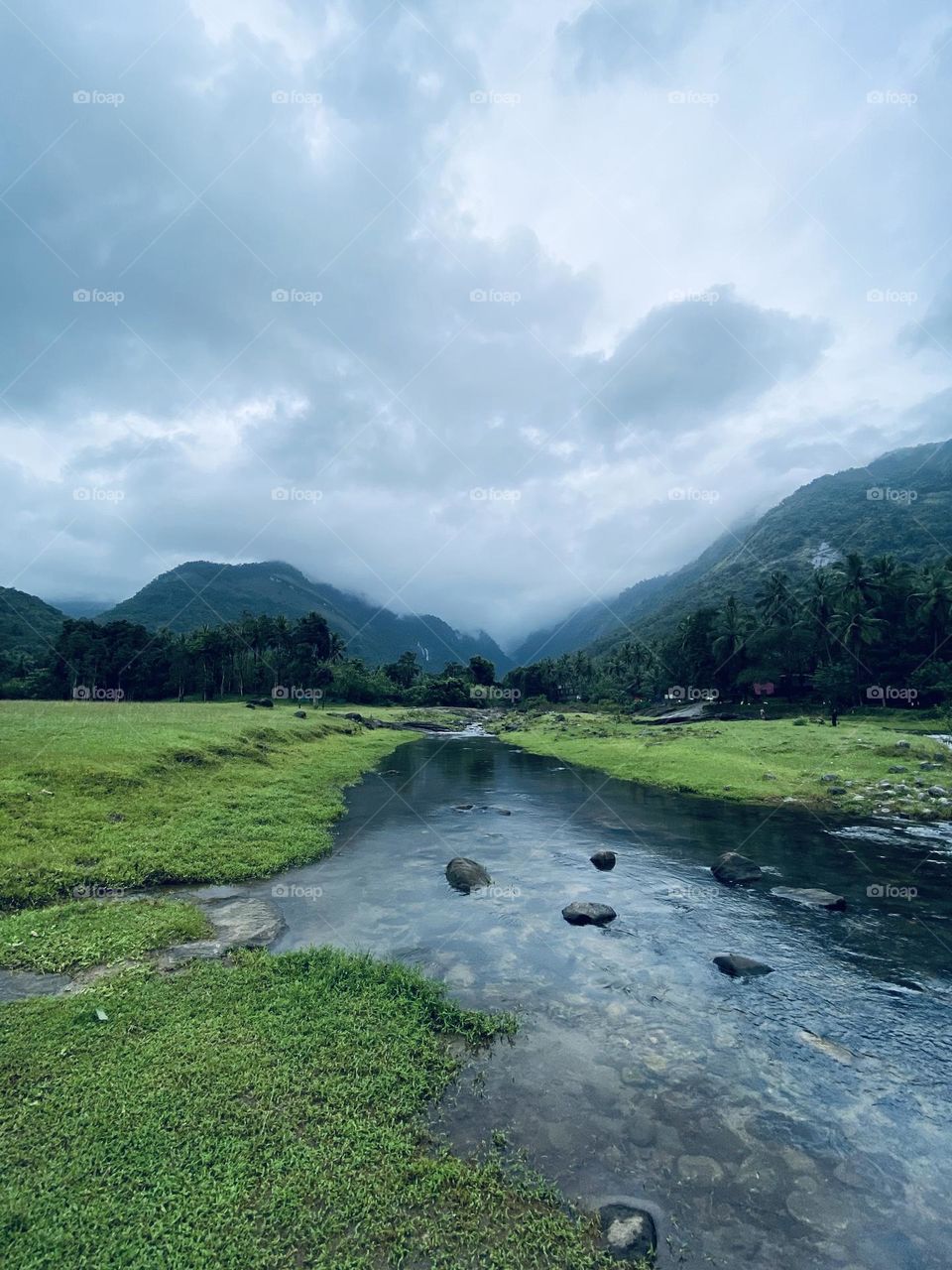 Clear view of green hills in a water