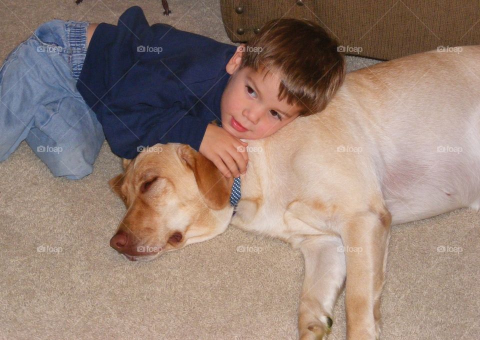 Boy and dog cuddling