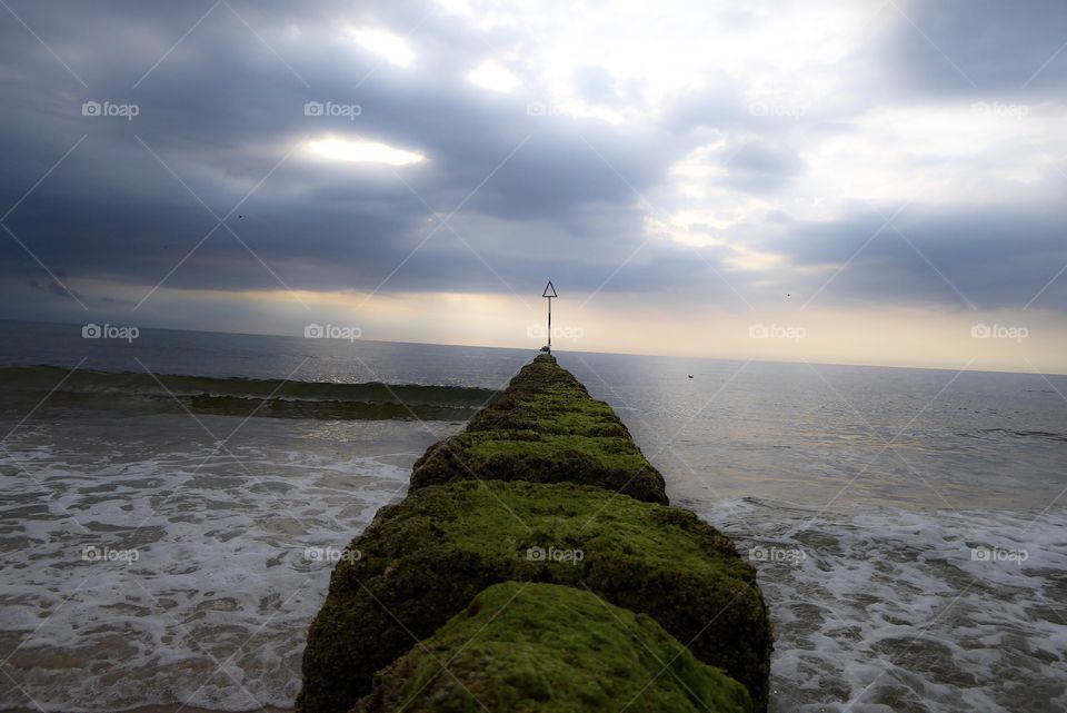 Breakwater on the North Sea beach. On a stormy day in the summer of 2019 on the island of Sylt