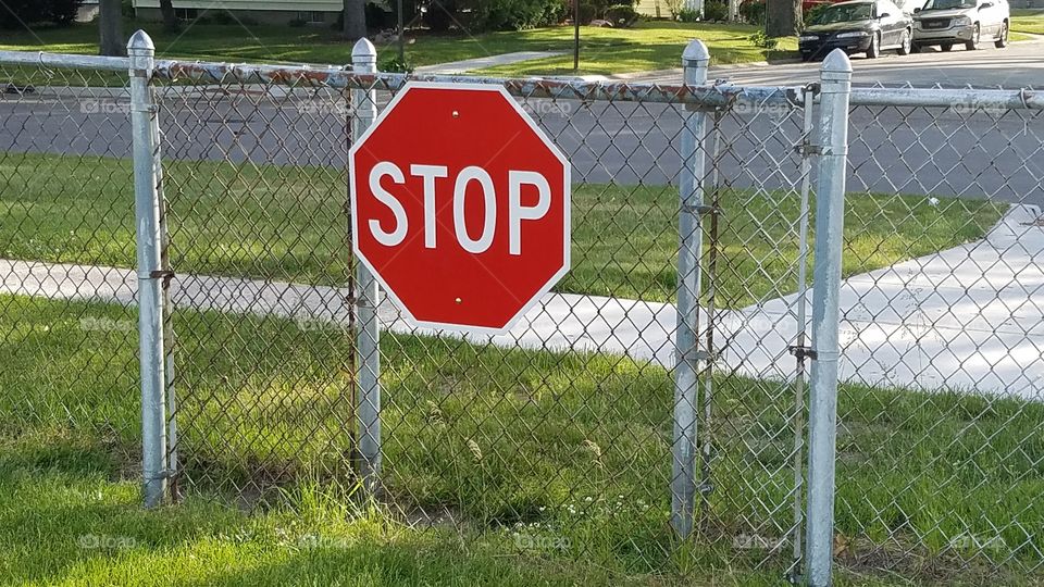 stop sign on a gate