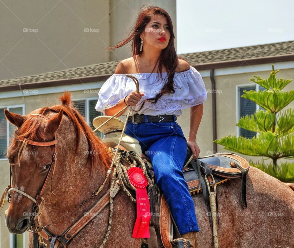 Sexy Cowgirl. Latina Woman On Horseback
