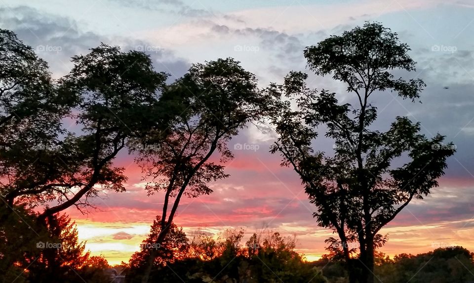 The opening peek of an October sunrise in Fairfax, Ohio.