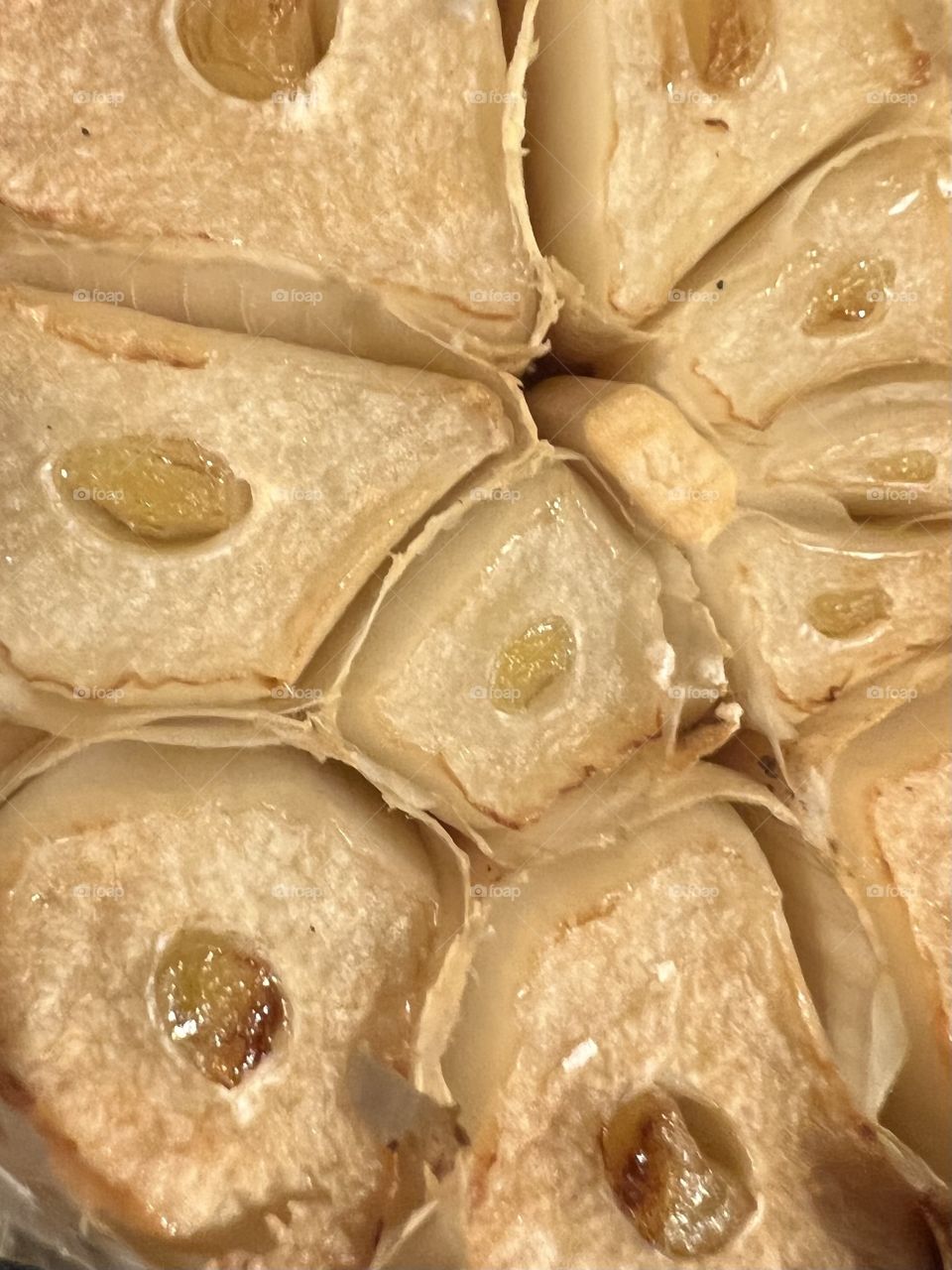 Toasted garlic close up of cut garlic clove toasted