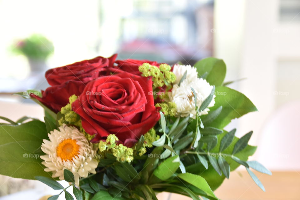 Flowers as present with red roses
