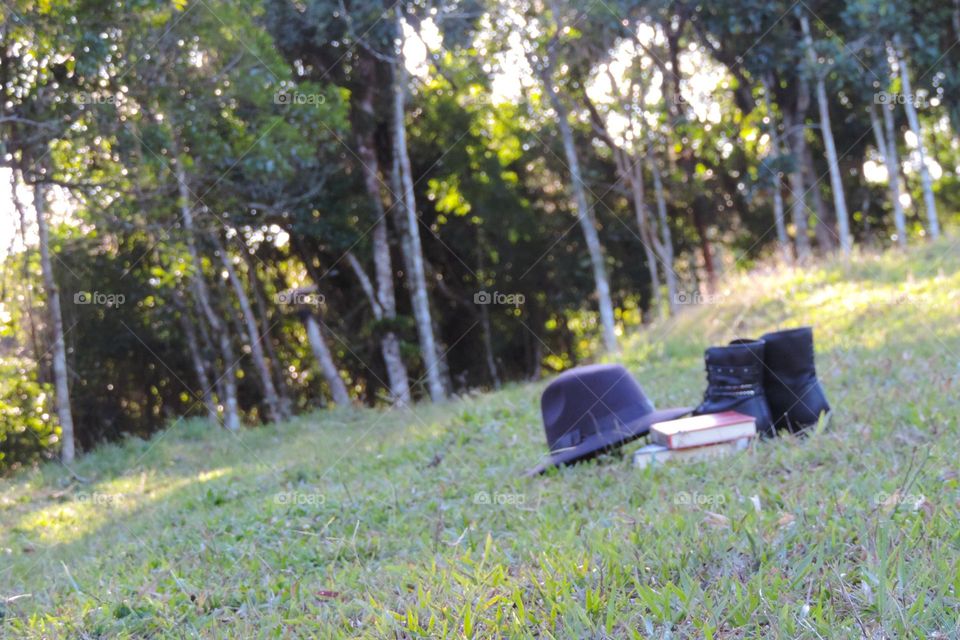 Books, hat and boots, for walking and resting.