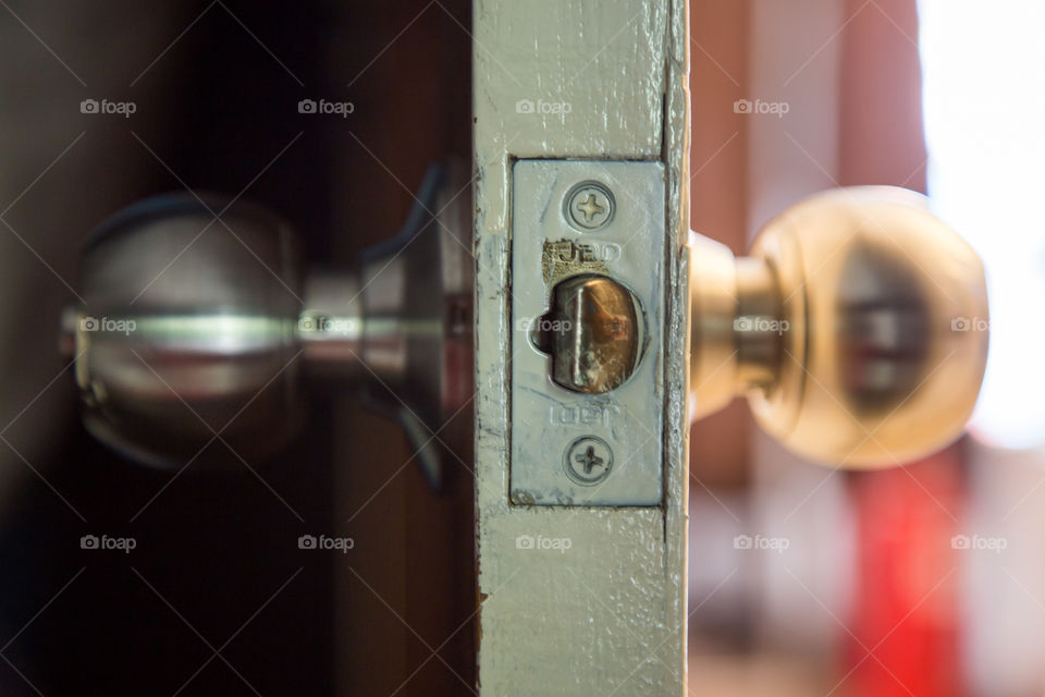 Close-up of doorknob with lock
