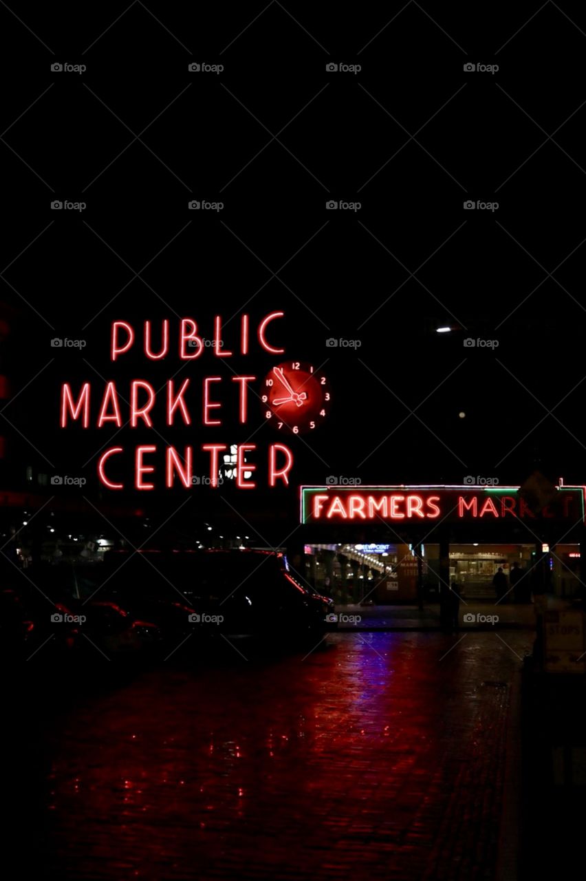 The neon lights of night life at the famous wharf near Pikes Place Market in downtown Seattle Washington. 