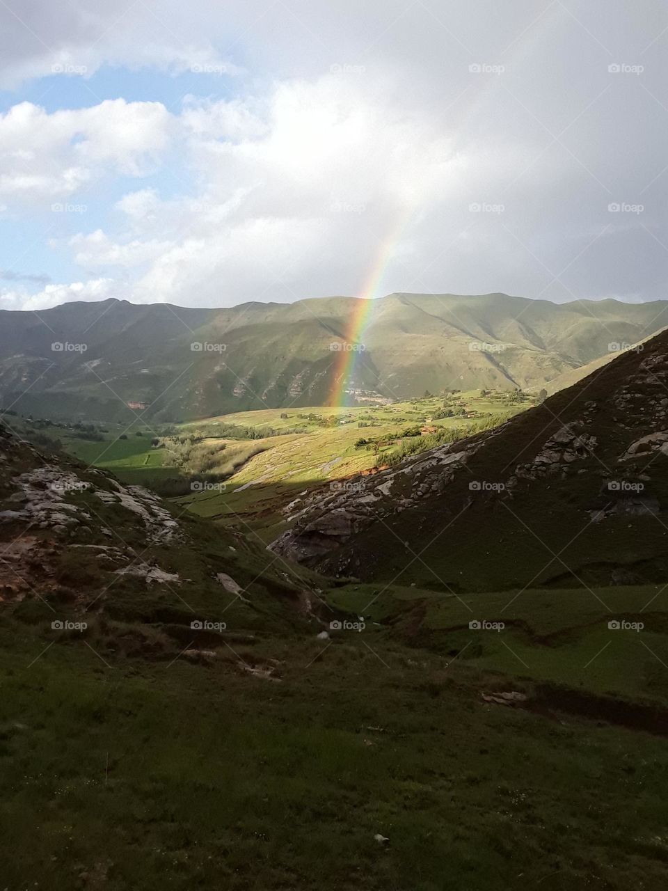 A beautiful view of rainbows after raining over the landscape.