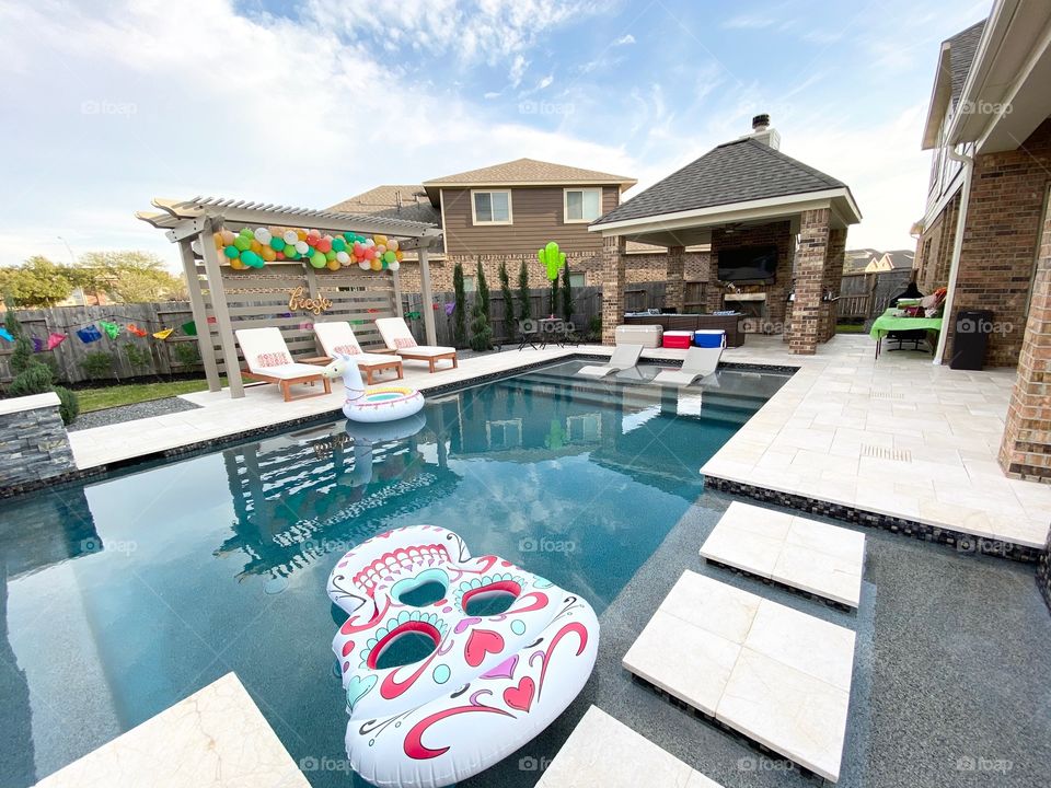 Colorful party decorations for a poolside fiesta in the backyard!