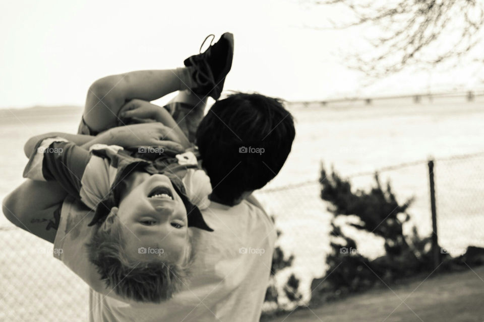 father and son laughing and playing