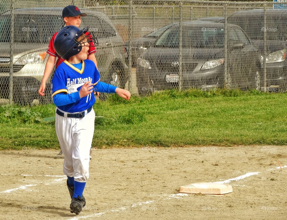 Young Ball Player Running The Bases