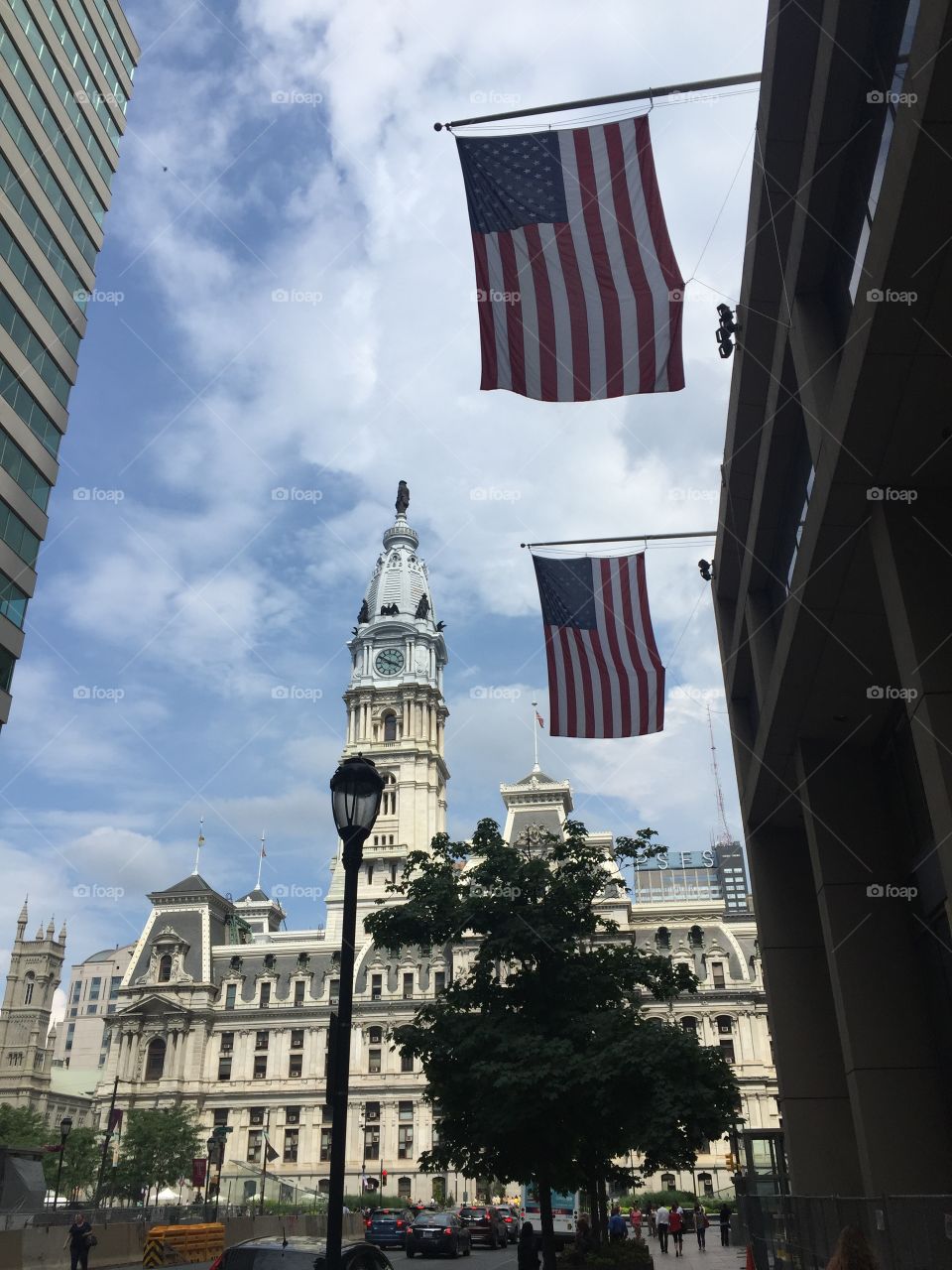 building with flags hanging in a city