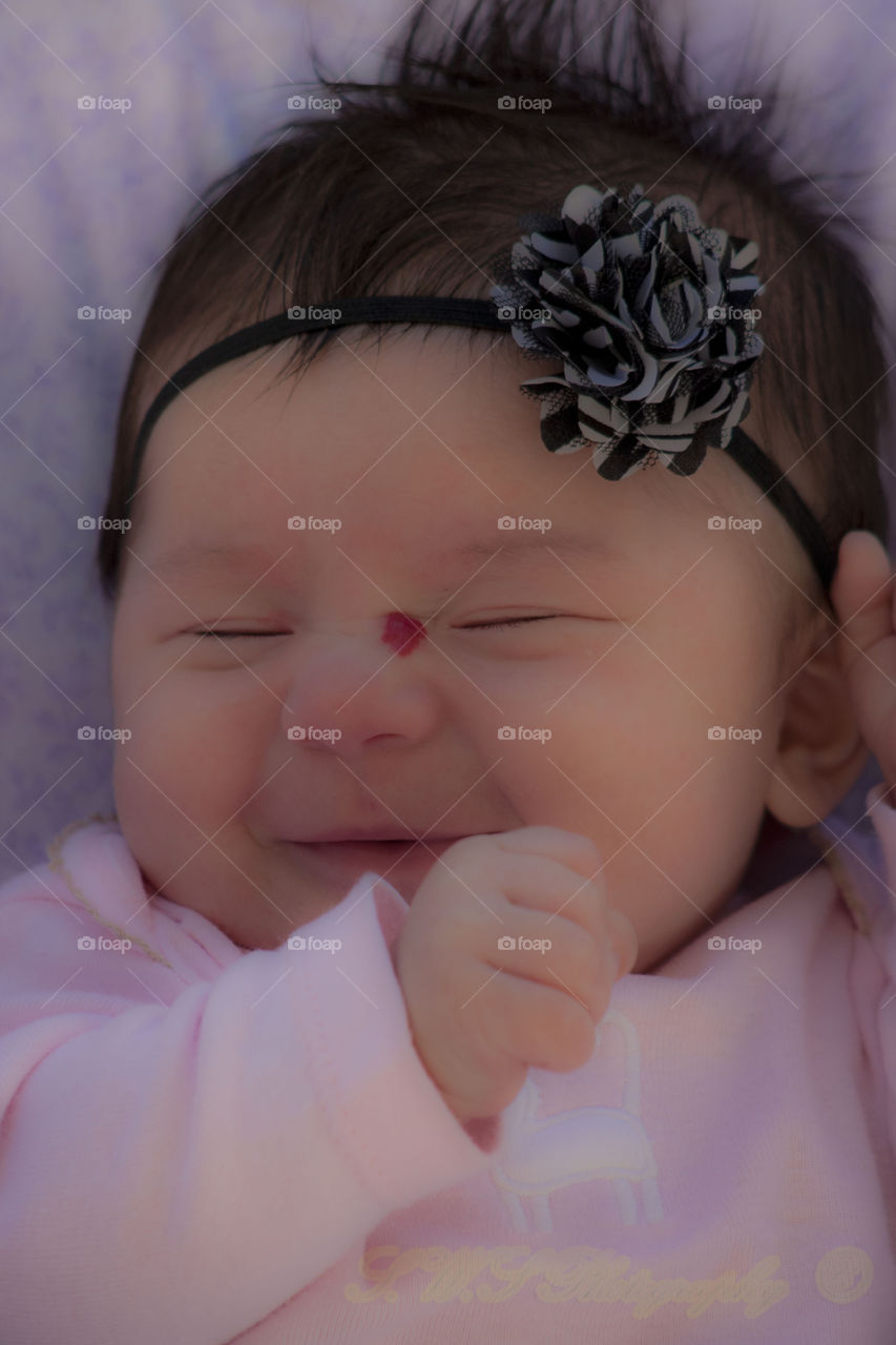 Smiling cute baby with hair band