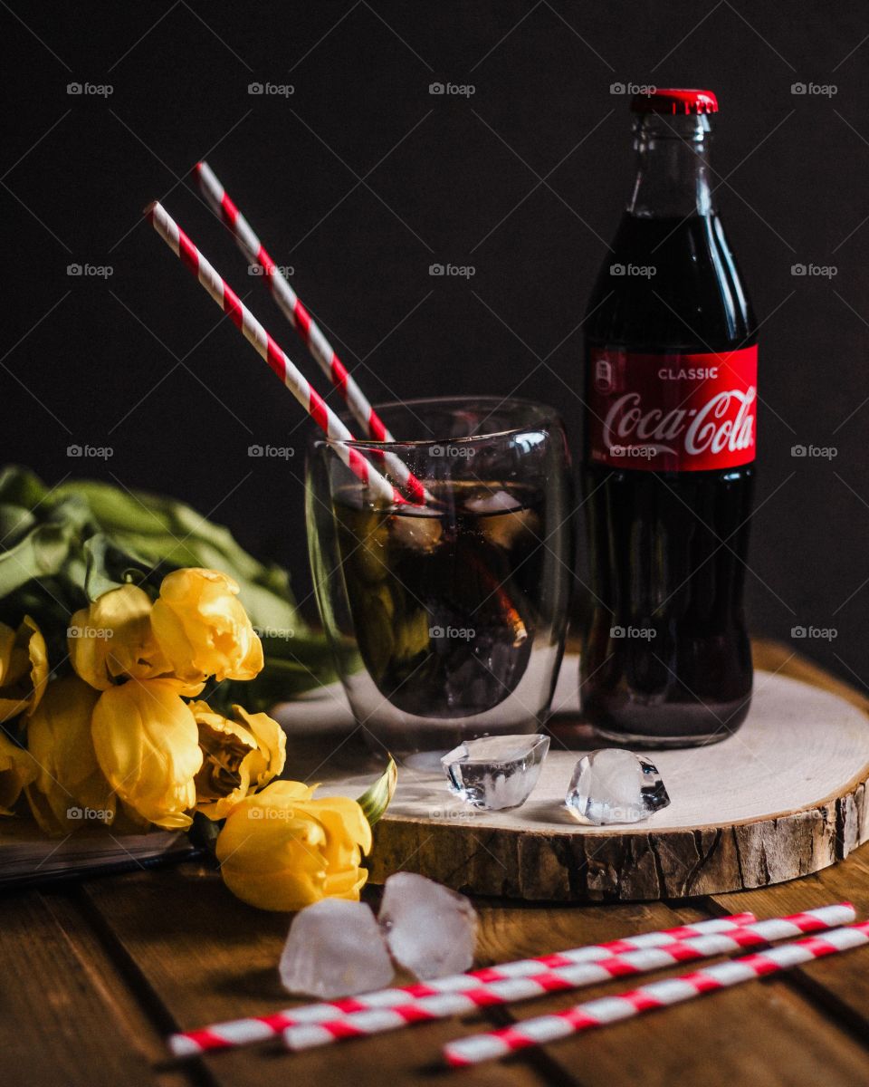 still life with coca cola and tulips