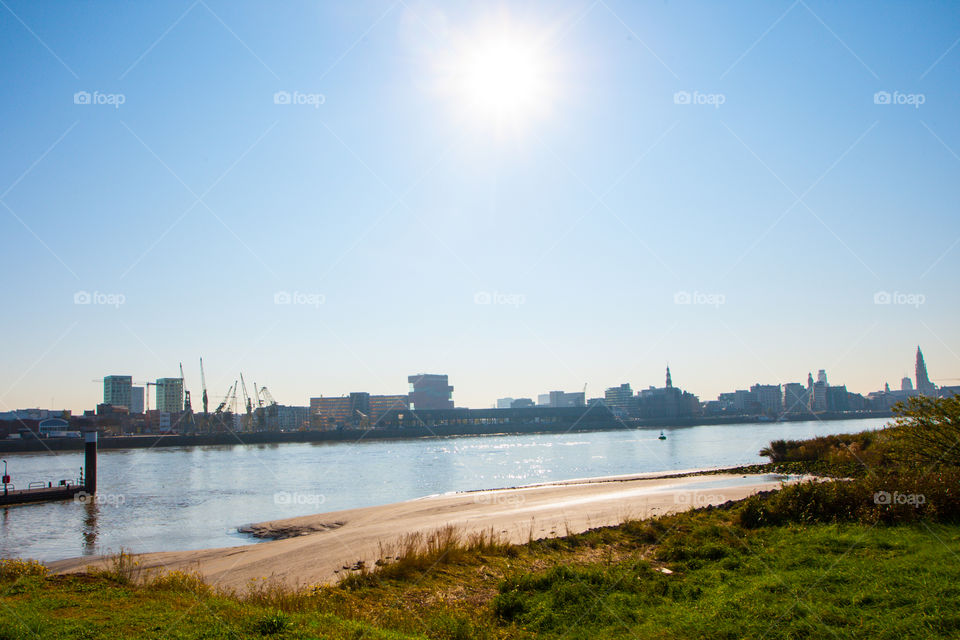 Riverside landscape under the sun 