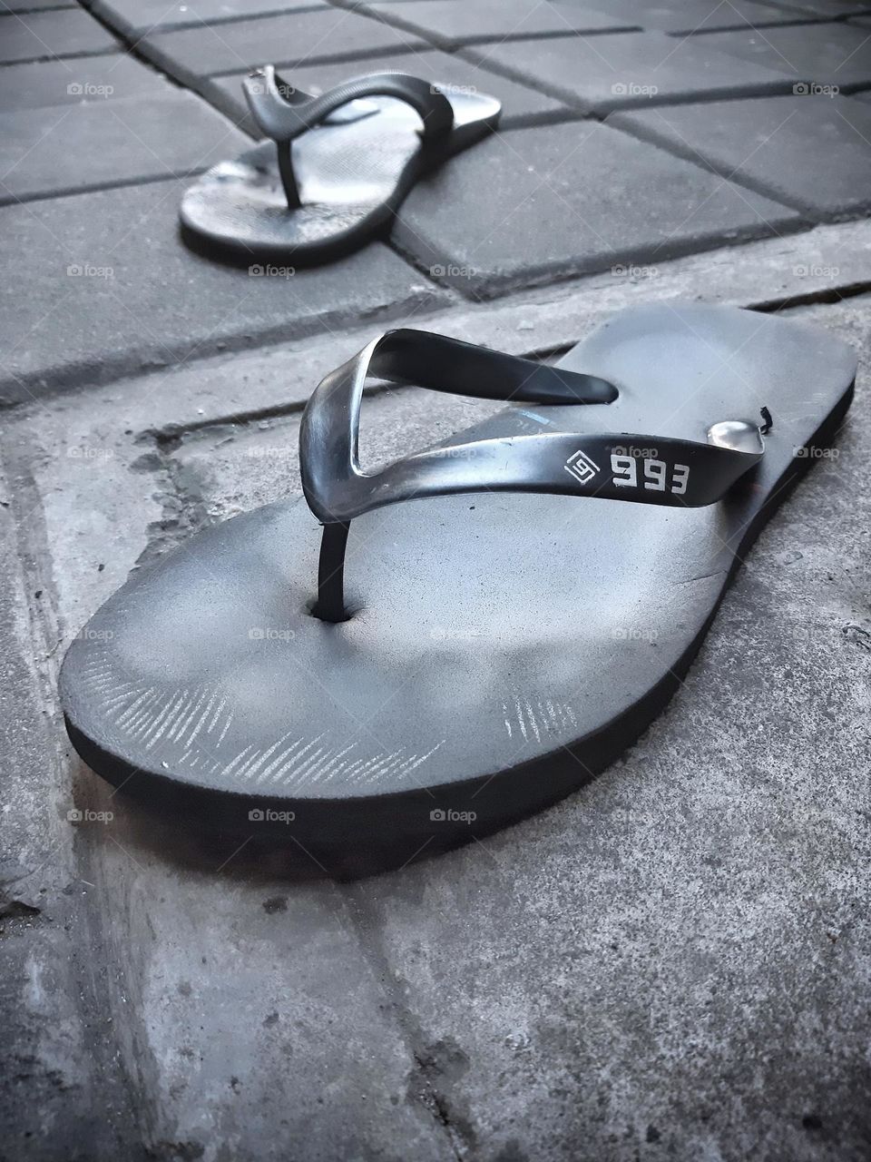 a pair of trendy black sandals for men in Indonesia