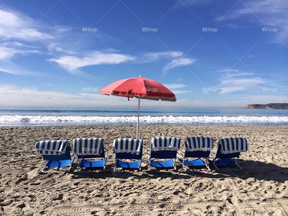 Umbrella and beach chairs