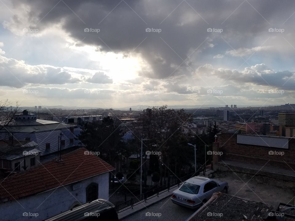 sun falling behind the clouds in Ankara, turkey