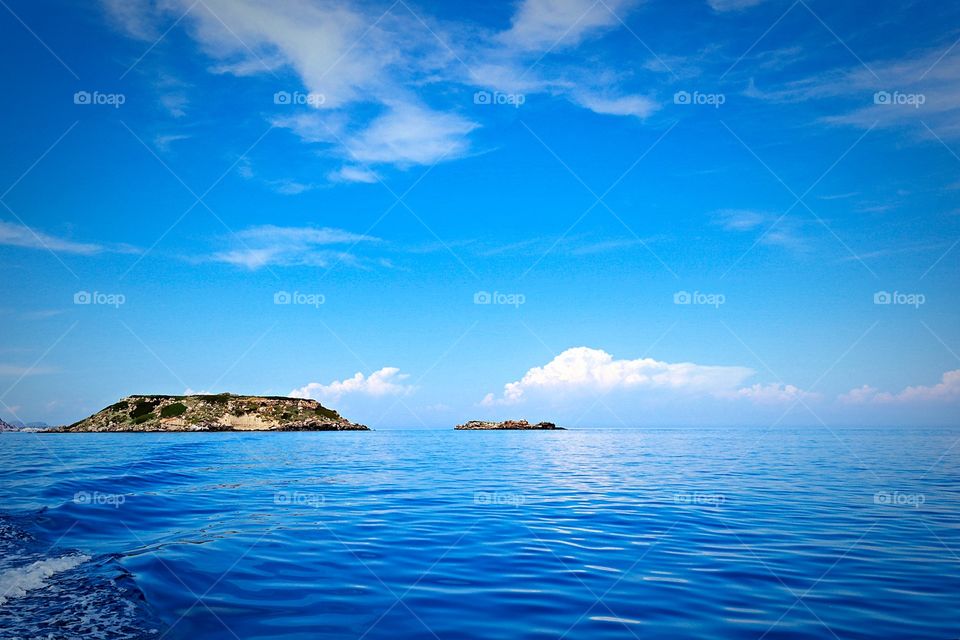 Island without people. Blue waters of Rhodos island 