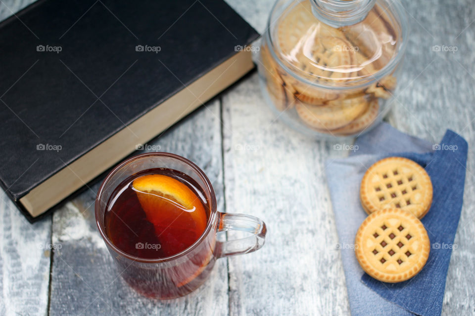 High angle view of tea cup and biscuits