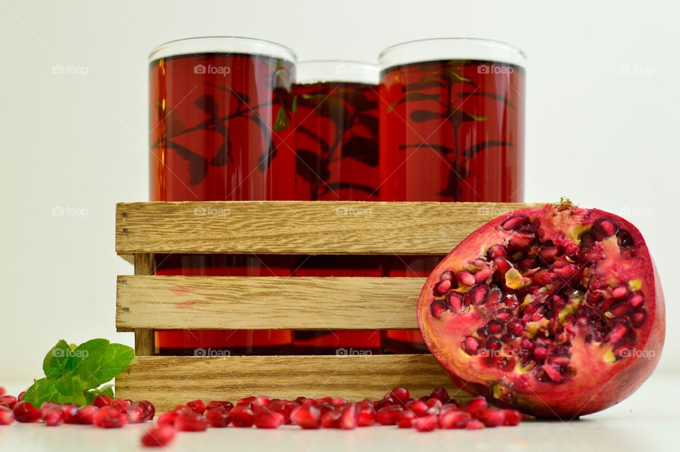 three glasses of pomegranate juice