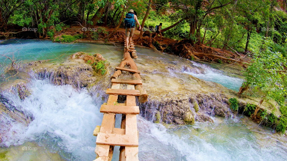 Crossing a bridge over Havasu Creek in the bottom of the Grand Canyon