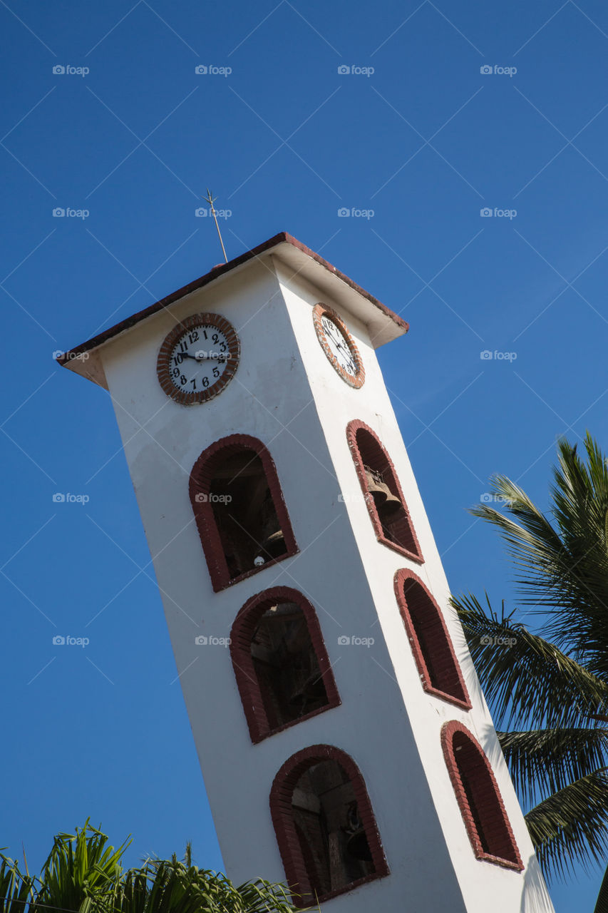 Clock Tower. Mexican tower against blue sky