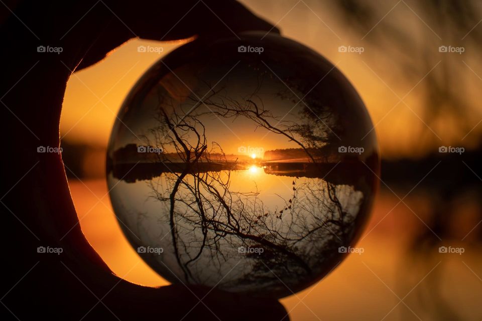 Watching the sunrise through a crystal ball. Lake Benson, Garner, North Carolina. 