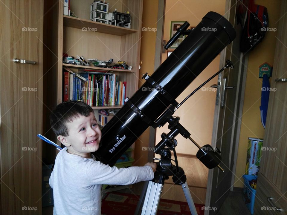 Boy and telescope