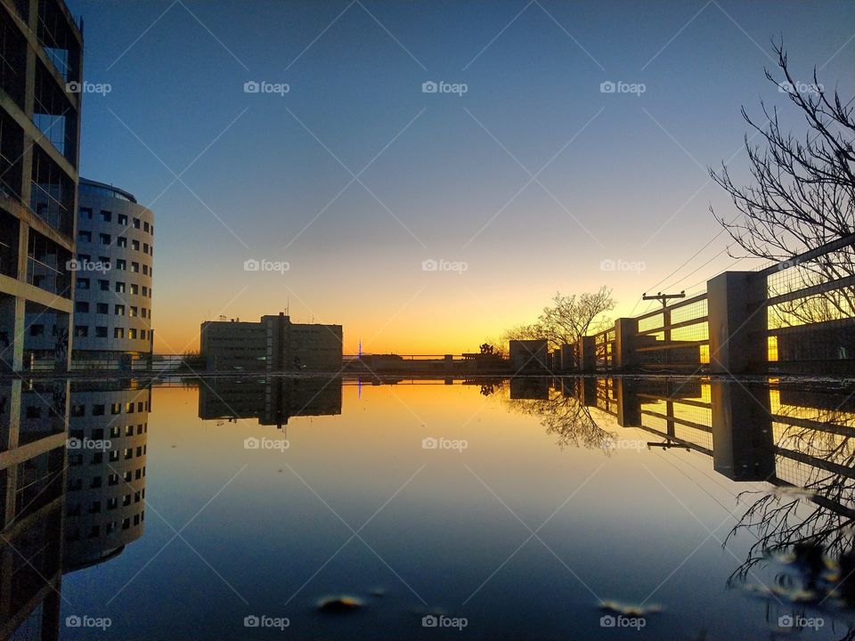 Sunset mirroring in the city.