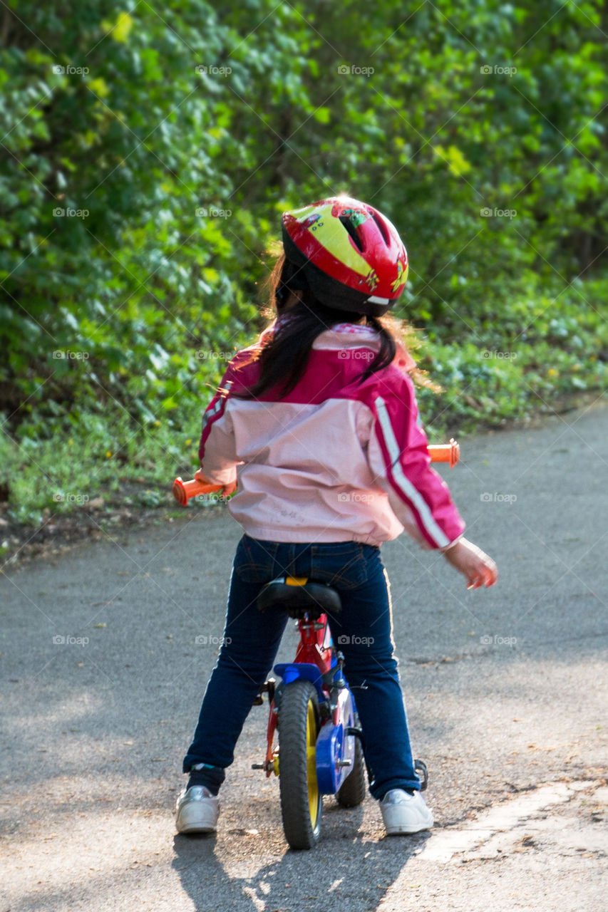 Little girl on her balance bike